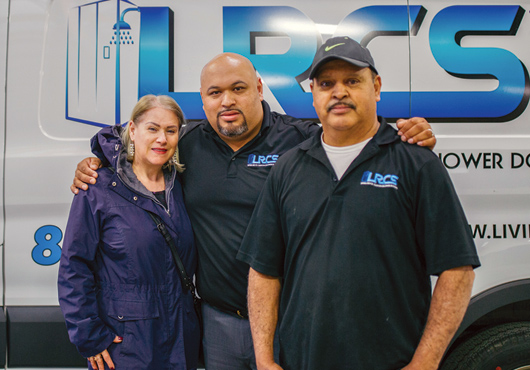 David Mesa (center) with his mother, Maria, who works in the office, and his father, Jorge, who is an installer.