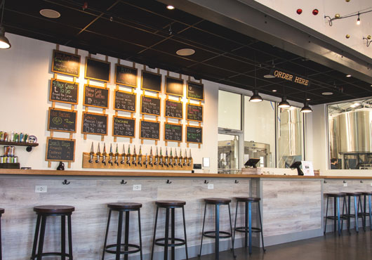 With an extensive network of subcontractors, MRG Construction Management, Inc. manages projects across Massachusetts, Connecticut, Rhode Island, Vermont, New Hampshire and Maine. Shown here: the newly renovated True North Ale Company brewery tap room in Ipswich, Massachusetts. 