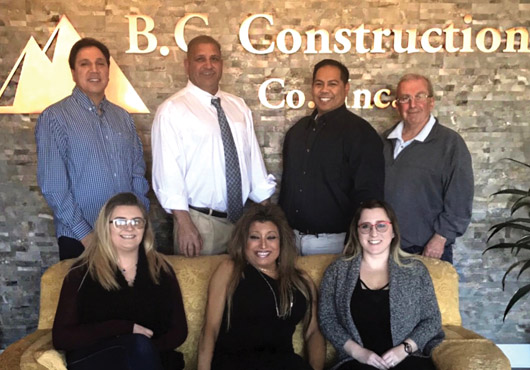 B.C. Construction Co., Inc.’s founder and President Michael Cresta (second from left in back row) with members of his office staff. 