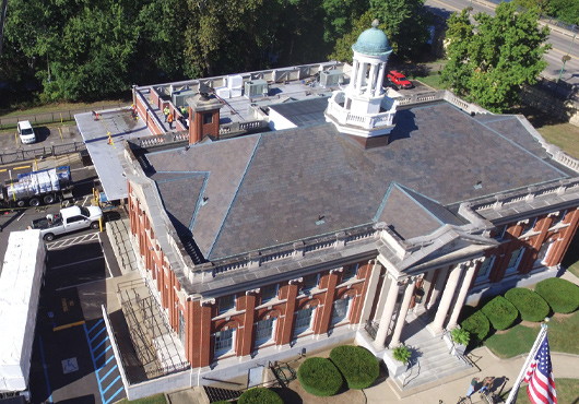 This re-roof project of a historic post office in Marietta, Ohio, was challenging due to the inability to shut down the parking lot for longer than a four-hour window.