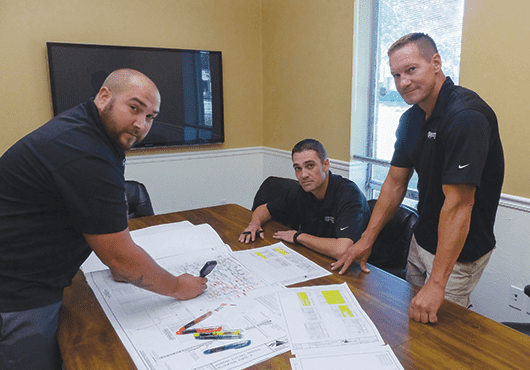 Members of the Reliable Electric, Inc. team prepare for an upcoming job. Pictured from left to right: Kyle Back, Jake Allen, Matt Minor.