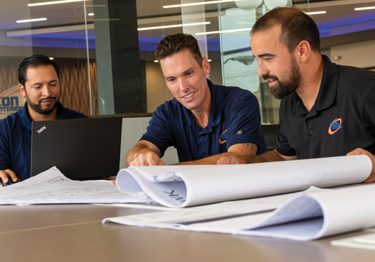 Pictured left to right: Icon Interiors Inc.’s Estimator Jameson Pagan, President Glenn Pickens, and General Superintendent, Kevin Carver, meet to discuss one of the firm’s numerous commercial projects.