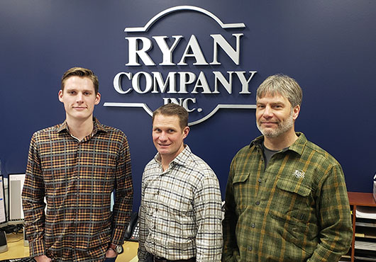 Interior 1: President Matt Hornibrook (center) is pictured with members of his team, Project Coordinator Alec Williams (left) and Senior Project Manager Kyle Wells.