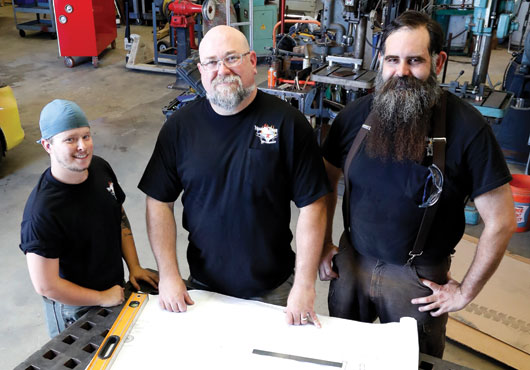 Jarred Coolidge (left), Welder/Fabricator, and Ben Milford (right), Welder/Fabricator and CNC Operator, are two of Lee Lanford’s (center) expert craftsmen.