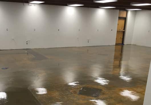 Crews self-leveled the concrete and installed flooring at the Torrey Pines High School science building in San Diego.