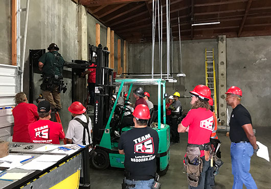 R&S Overhead Garage Door, Inc. employees participate in a fire door certification class at the R&S Erection, Inc. training facility in San Leandro, CA.