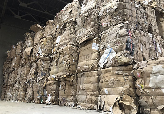 Bales of recovered cardboard are ready for shipping to a local paper mill.