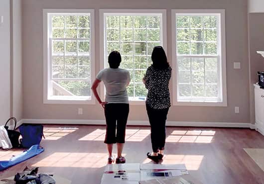 Andrea Garwood consults with a residential customer to discuss her window film needs. 