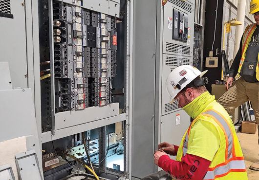 Garrett Rogers secures an additional section to the main switchboard at Serioplast US in Red Springs, NC.