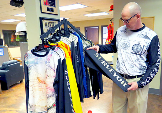 Matt Nawrocki inspects the company’s Kinematic clothing line.