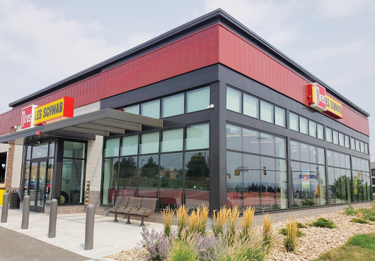 At this sleek Les Schwab Tire Center in Broomfield, CO, All Star Glass installed front-set storefront windows, storefront doors and brake-metal-wrapped beams.