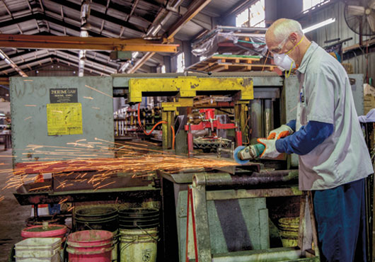 Paragon Steel shop team member, Joe Kramer, prepares a custom product for a customer.