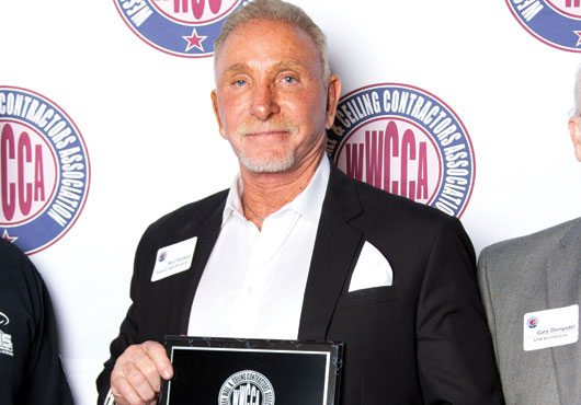 Ron Hudson, President and CEO of Superior Wall Systems, Inc., accepts the Western Wall & Ceiling Contractors Association’s 2019 Walter F. Pruter Project of the Year Award for its work on the NOHO West retail center in North Hollywood.