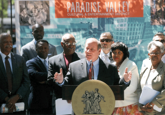 Detroit Mayor Duggan, with developers, announcing the Paradise Valley Cultural and Entertainment District to local press and community leaders in Harmonie Park.