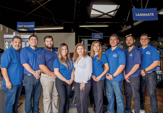 Dura Flooring, Inc. owner Trini Alday (center, white shirt) with the company’s installations department.