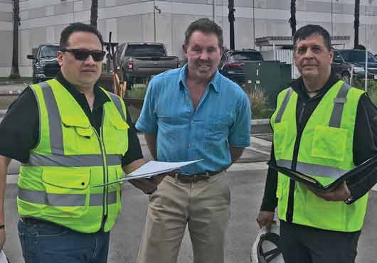 A team from Specguard conducts a project evaluation for a reconditioning system for an existing metal roof. Pictured (from left to right) are Jason Marquez, consultant; Larry Morris, Territory Sales Manager; and Larry Lizotte, Vice President and Sales Director.