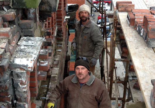 Jeff Bruno (front) and Denis Bruno rebuild sections of St. Stanislaus Kostka Church located in the Strip District of Pittsburgh.