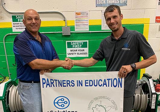 eSolutions Electrical Contracting President Chris Egress (right) with Ed Conch from the United Technical Center in Clarksburg, West Virginia. The company is part of the center’s Partners in Education program to promote trade schools in northern West Virginia.