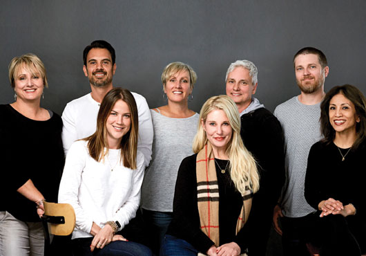 The staff of Studio Image Inc. (sitting, left to right): Ashley Calhoun, Danielle Pruitt and Anilyn Fabello; (standing, left to right): Kerstin Goerndt, Carlos Seckler, Yvonne Goerndt, Sigi Goerndt and Josh Haley.