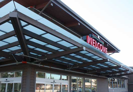 Dahl Glass provided the storefronts and glass canopies for the Town & Country Market on Bainbridge Island, Washington.