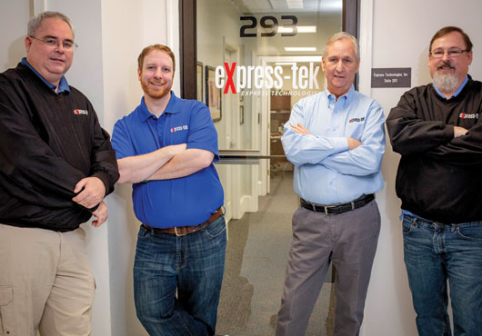 Express Technologies, Inc. is a family business. Pictured (from left to right):  Executive Vice President Stephen Brown, Business Manager Matt Norris, Founder  and President Fred Brown and Senior Project Manager of Engineering David Brown. Stephen and David are Fred’s sons and Matt is his son-in-law.